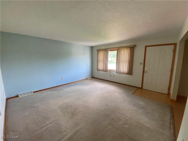 6234 W 54th St, Parma, OH 44129 - empty room featuring light colored carpet, a textured ceiling, and baseboards