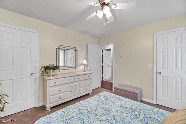 1421 Rolling Meadows Dr, Vermilion, OH 44089 - bedroom with baseboards, a ceiling fan, and dark carpet