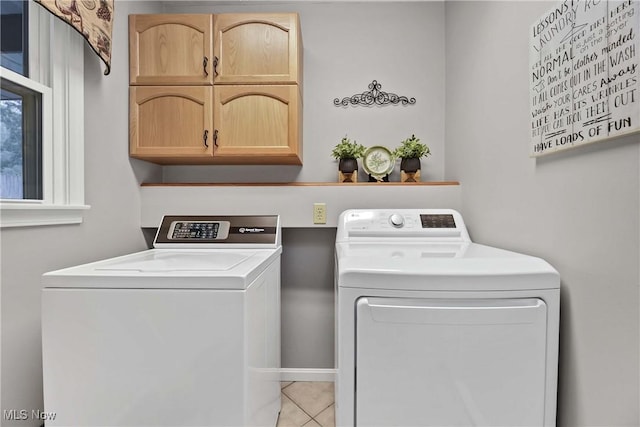 1421 Rolling Meadows Dr, Vermilion, OH 44089 - washroom with cabinet space, separate washer and dryer, and tile patterned floors