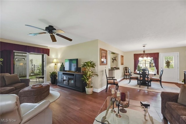 1421 Rolling Meadows Dr, Vermilion, OH 44089 - living area featuring wood finished floors, ceiling fan, a chandelier, and baseboards