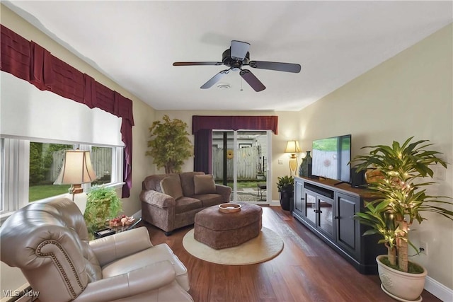 1421 Rolling Meadows Dr, Vermilion, OH 44089 - living area featuring dark wood-type flooring, ceiling fan, and baseboards