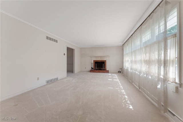923 Hillcrest Ave SW, North Canton, OH 44720 - unfurnished living room with light colored carpet, a fireplace, ornamental molding, and baseboard heating