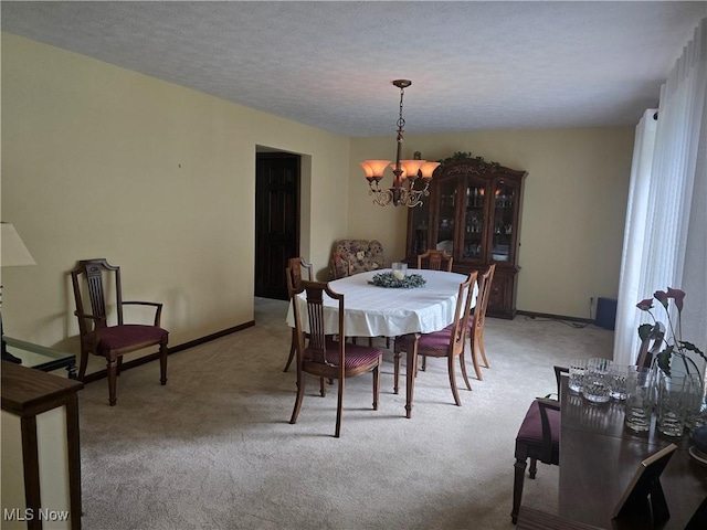 462 Farr Ave, Wadsworth, OH 44281 - dining area featuring a chandelier, light carpet, baseboards, and a textured ceiling