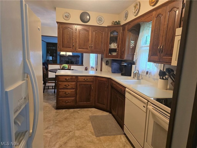 462 Farr Ave, Wadsworth, OH 44281 - kitchen featuring white appliances, light countertops, glass insert cabinets, and a sink