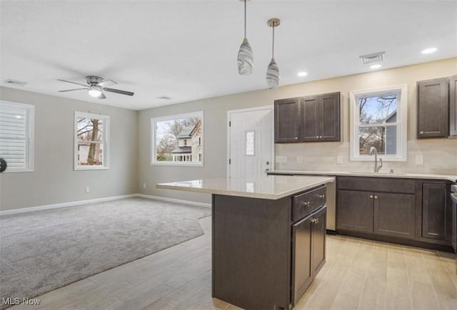 151 E 5th St, Salem, OH 44460 - kitchen featuring a sink, light wood-style floors, healthy amount of natural light, dark brown cabinets, and recessed lighting
