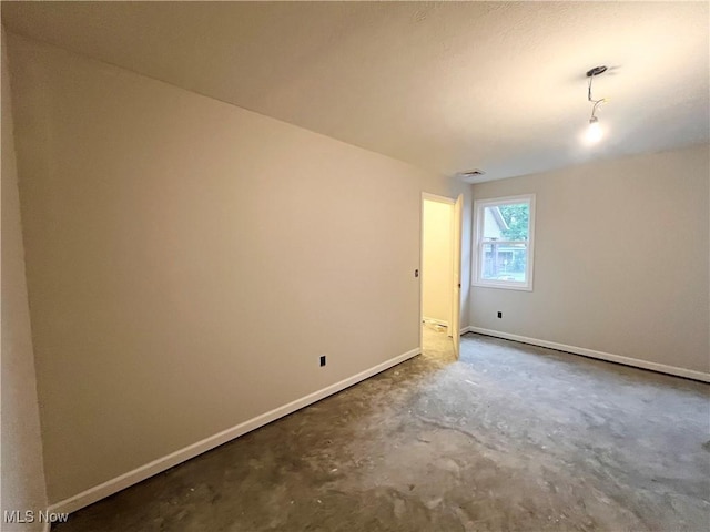 151 E 5th St, Salem, OH 44460 - spare room with unfinished concrete flooring and baseboards