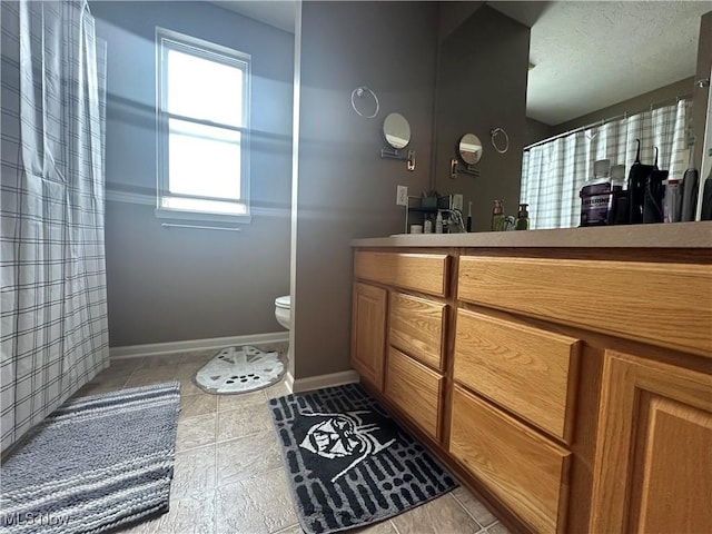 2280 Becket Cir, Stow, OH 44224 - full bathroom featuring vanity, toilet, baseboards, tile patterned floors, and curtained shower