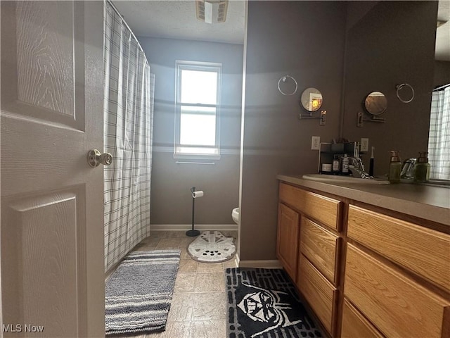 2280 Becket Cir, Stow, OH 44224 - bathroom featuring vanity, baseboards, toilet, and tile patterned flooring