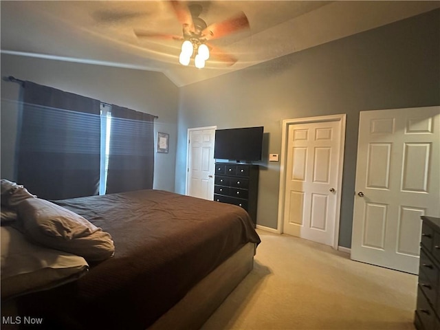 2280 Becket Cir, Stow, OH 44224 - bedroom featuring light colored carpet, lofted ceiling, two closets, a ceiling fan, and baseboards