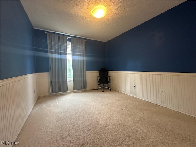 2280 Becket Cir, Stow, OH 44224 - carpeted spare room with wainscoting, a textured ceiling, and vaulted ceiling