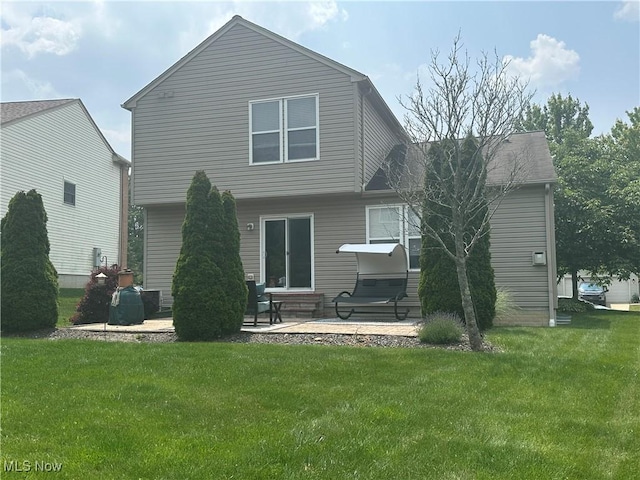 2280 Becket Cir, Stow, OH 44224 - rear view of house featuring a patio, a lawn, and entry steps