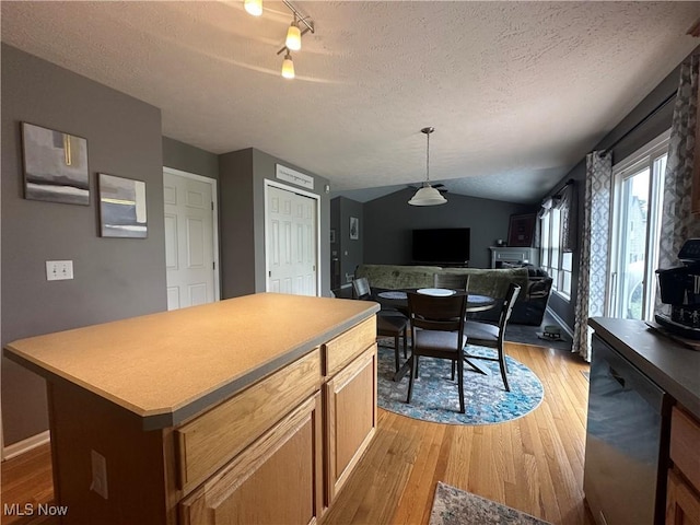 2280 Becket Cir, Stow, OH 44224 - dining space with light wood-type flooring, a textured ceiling, rail lighting, and lofted ceiling