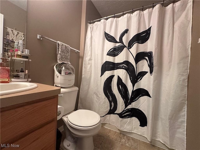 2280 Becket Cir, Stow, OH 44224 - bathroom with toilet, vanity, tile patterned flooring, a textured ceiling, and curtained shower