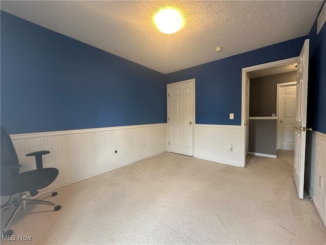 2280 Becket Cir, Stow, OH 44224 - unfurnished bedroom featuring a wainscoted wall, carpet flooring, and a textured ceiling