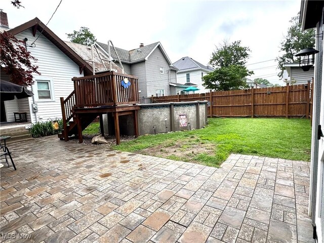 354 Hamilton Ave, Coshocton, OH 43812 - back of house featuring stairs, a deck, and a patio area