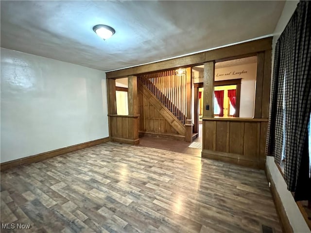 354 Hamilton Ave, Coshocton, OH 43812 - empty room featuring stairway, wood finished floors, and baseboards