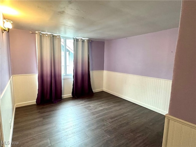 354 Hamilton Ave, Coshocton, OH 43812 - spare room with wood finished floors and wainscoting