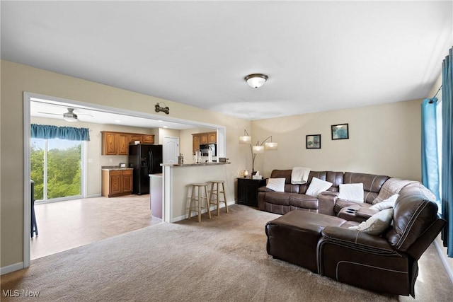 60922 Webb Heights Rd, Shadyside, OH 43947 - living room featuring light colored carpet, baseboards, and ceiling fan