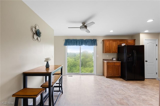 60922 Webb Heights Rd, Shadyside, OH 43947 - kitchen featuring black fridge, ceiling fan, brown cabinets, baseboards, and recessed lighting