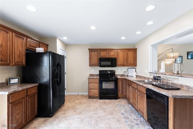 60922 Webb Heights Rd, Shadyside, OH 43947 - kitchen with black appliances, a sink, recessed lighting, brown cabinets, and baseboards