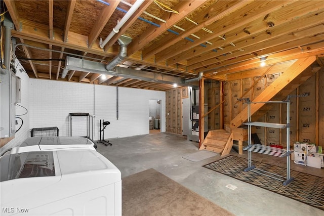 60922 Webb Heights Rd, Shadyside, OH 43947 - unfinished below grade area featuring washer and dryer and heating unit