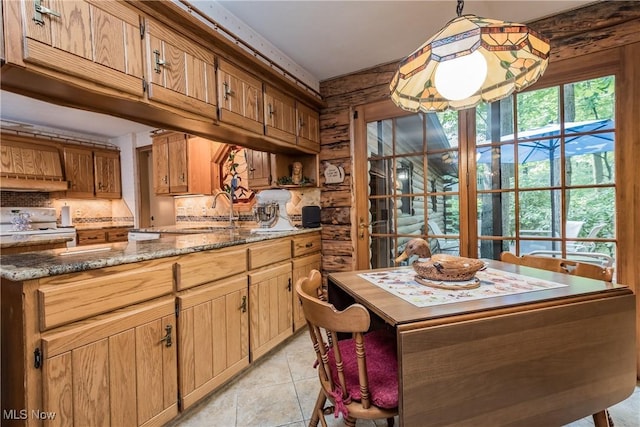 5820 Kildare Cir NW, Canton, OH 44718 - kitchen featuring a sink, white range with electric stovetop, decorative backsplash, light tile patterned floors, and light stone countertops