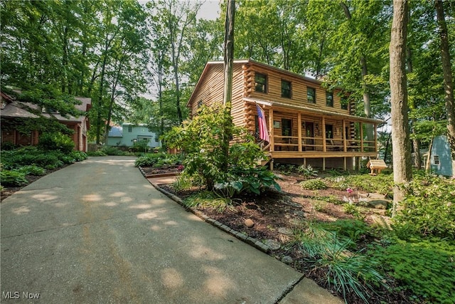 5820 Kildare Cir NW, Canton, OH 44718 - log cabin featuring log exterior and a porch