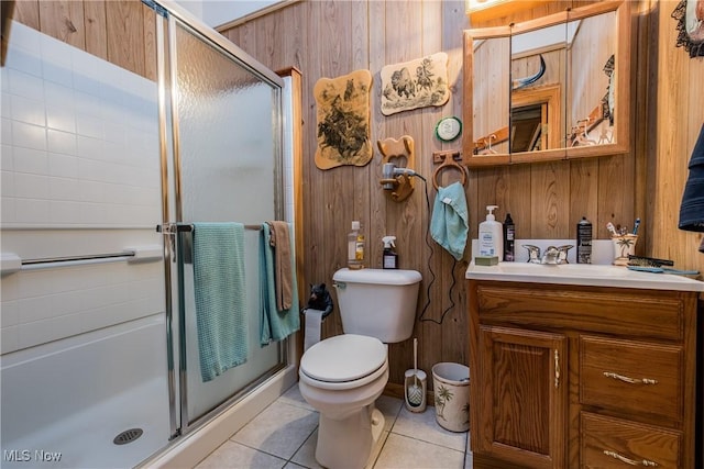 5820 Kildare Cir NW, Canton, OH 44718 - full bathroom featuring wooden walls, vanity, tile patterned floors, a shower stall, and toilet