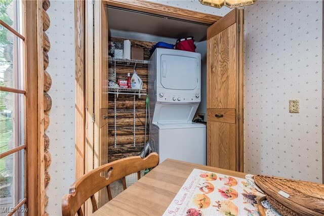 5820 Kildare Cir NW, Canton, OH 44718 - laundry area featuring wallpapered walls, stacked washer / drying machine, and plenty of natural light
