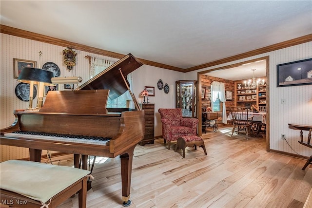 5820 Kildare Cir NW, Canton, OH 44718 - sitting room featuring wallpapered walls, a chandelier, wood finished floors, crown molding, and baseboards