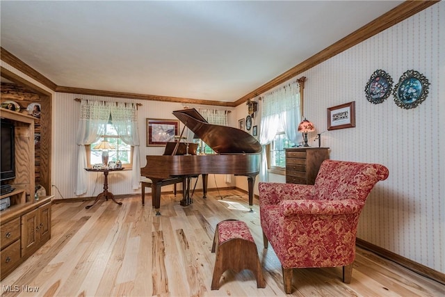 5820 Kildare Cir NW, Canton, OH 44718 - sitting room with ornamental molding, wallpapered walls, light wood finished floors, and baseboards