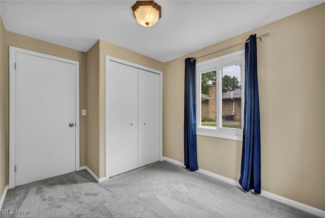 713 Highland Ave, Wadsworth, OH 44281 - unfurnished bedroom featuring carpet flooring, a closet, and baseboards