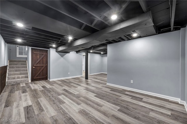 713 Highland Ave, Wadsworth, OH 44281 - finished basement with wood finished floors, stairway, and baseboards