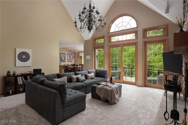 4151 Williamsburg Ct, Medina, OH 44256 - carpeted living room featuring a chandelier and high vaulted ceiling