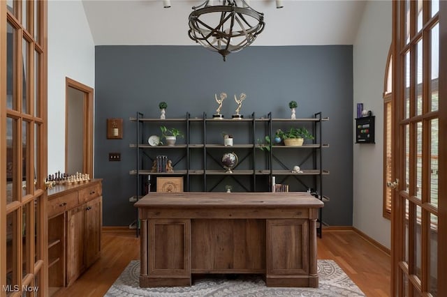 4151 Williamsburg Ct, Medina, OH 44256 - office featuring a chandelier, vaulted ceiling, light wood-style flooring, and baseboards