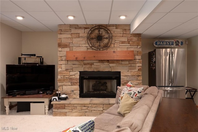 4151 Williamsburg Ct, Medina, OH 44256 - living area featuring a paneled ceiling, recessed lighting, and a stone fireplace
