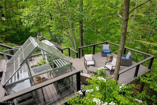 4151 Williamsburg Ct, Medina, OH 44256 - wooden deck featuring an outdoor hangout area and a forest view