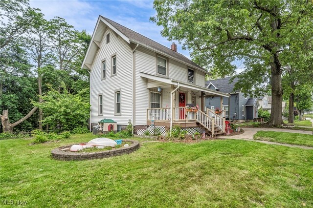 158 Humbolt Ave, Wadsworth, OH 44281 - view of front of property with a porch, a chimney, and a front yard