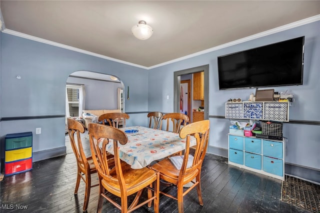 158 Humbolt Ave, Wadsworth, OH 44281 - dining area featuring arched walkways, hardwood / wood-style flooring, and crown molding