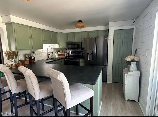 2405 Irish Ridge Rd, Philo, OH 43771 - kitchen featuring green cabinetry, fridge with ice dispenser, electric range oven, black microwave, and a sink
