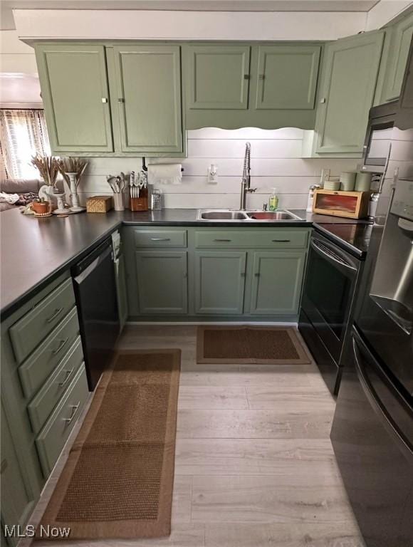 2405 Irish Ridge Rd, Philo, OH 43771 - kitchen featuring green cabinets, a sink, dishwasher, and light wood-type flooring