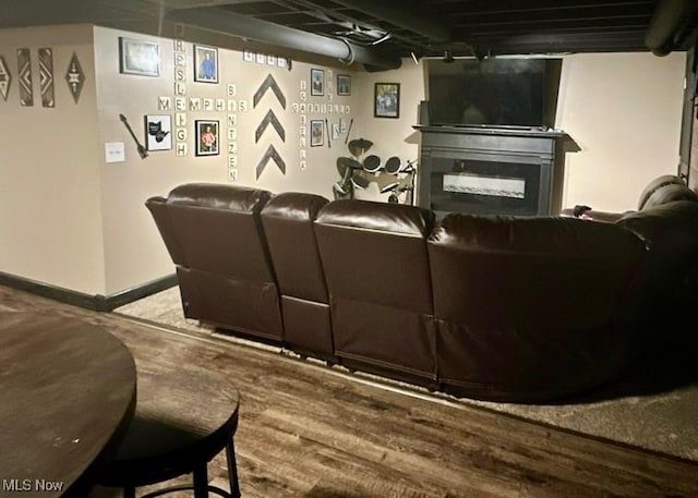2405 Irish Ridge Rd, Philo, OH 43771 - home theater featuring a fireplace, baseboards, and wood finished floors