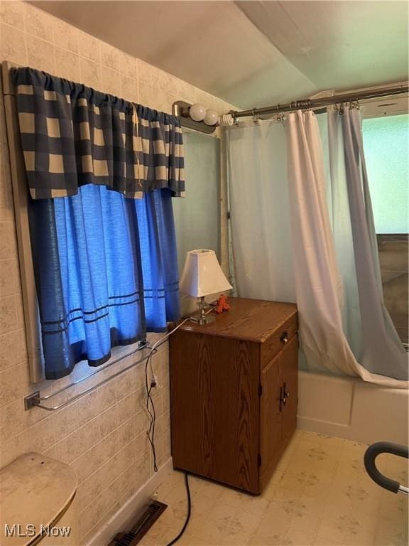 1723 W Prospect Rd, Ashtabula, OH 44004 - full bathroom with shower / tub combo with curtain and tile walls