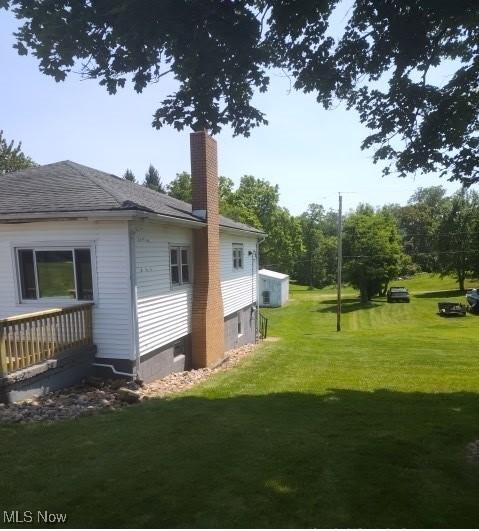 307 Township Road 245, Toronto, OH 43964 - view of side of property featuring a chimney and a lawn
