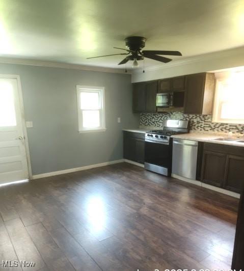 307 Township Road 245, Toronto, OH 43964 - kitchen with stainless steel appliances, ornamental molding, backsplash, ceiling fan, and a sink