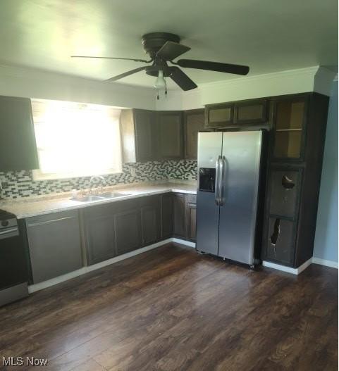 307 Township Road 245, Toronto, OH 43964 - kitchen featuring stainless steel fridge, a sink, light countertops, ceiling fan, and decorative backsplash