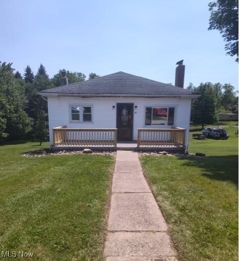 307 Township Road 245, Toronto, OH 43964 - bungalow with a chimney, a front yard, and covered porch