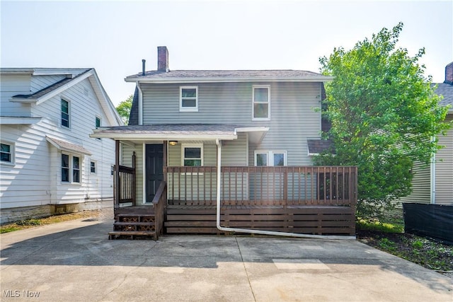 1260 Beardsley St, Akron, OH 44301 - rear view of house featuring a porch and a chimney