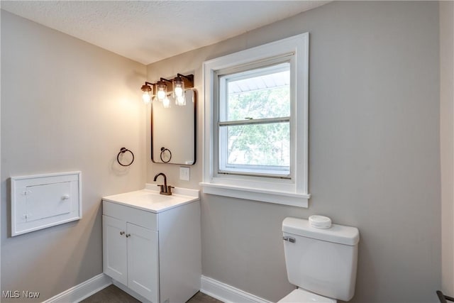 1260 Beardsley St, Akron, OH 44301 - bathroom with vanity, baseboards, and toilet