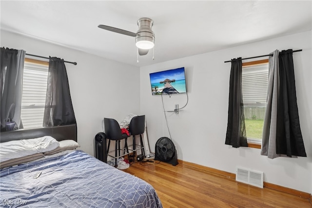 20800 Wilmore Ave, Euclid, OH 44123 - bedroom featuring wood finished floors, baseboards, and ceiling fan
